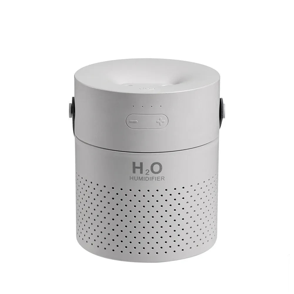 Slim USB rechargeable humidifier with water tank and colour options on a bedside table.
