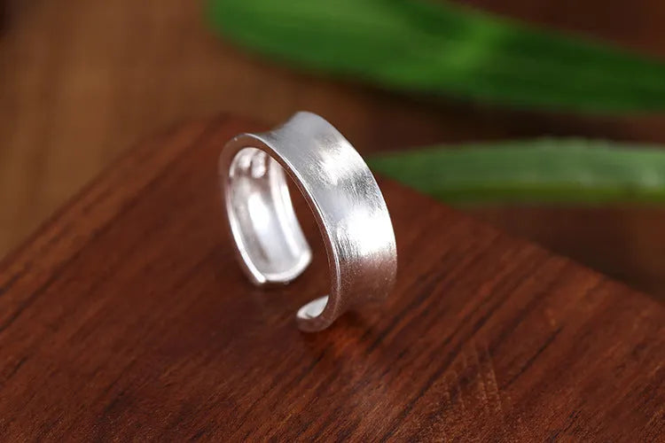 Geometric sterling silver ring with adjustable opening and frosted electroplated finish