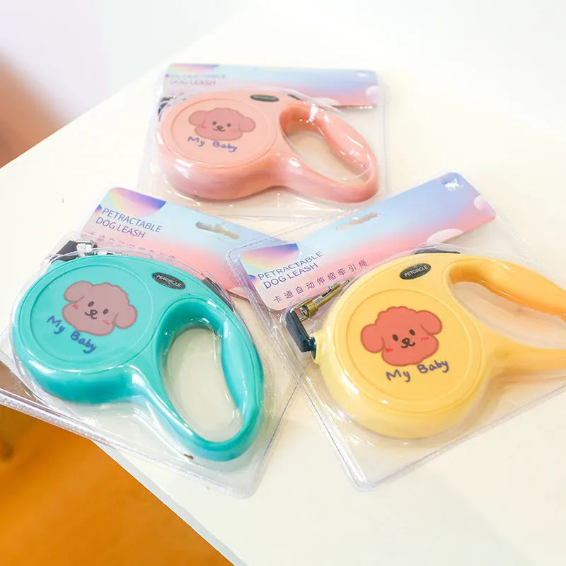 Plastic retractable dog leash 5 metres long cartoon design in blue, pink, and yellow colours