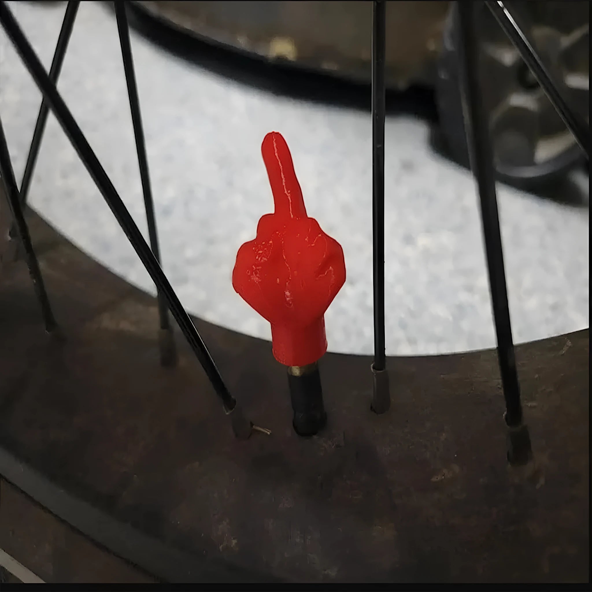 Four latex tyre valve dust caps showing black and skin colour pieces for car wheel valve protection