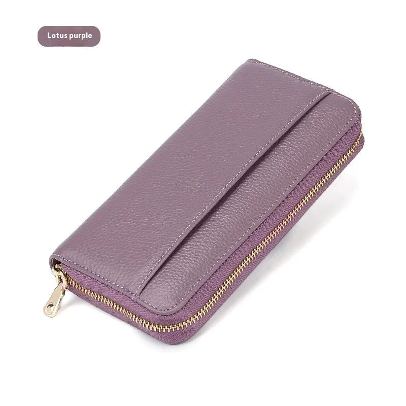 Women's long genuine leather wallet in multiple colours showing zip-around closure and anti-theft card slots.