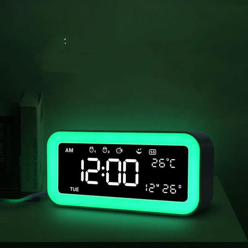 Blue rectangular LED atmosphere light alarm clock with digital display on wooden surface