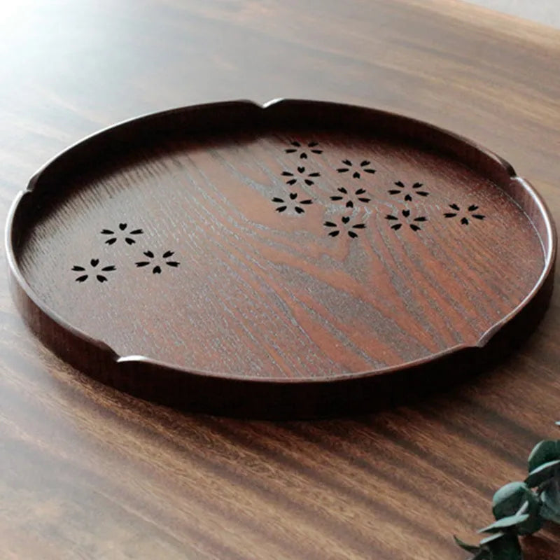 Wooden dessert plate with hollow cherry blossom pattern measuring 30 cm diameter