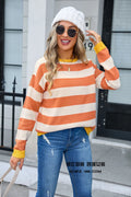 Women's loose-fit acrylic sweater with a floral striped pattern in a blue colour.