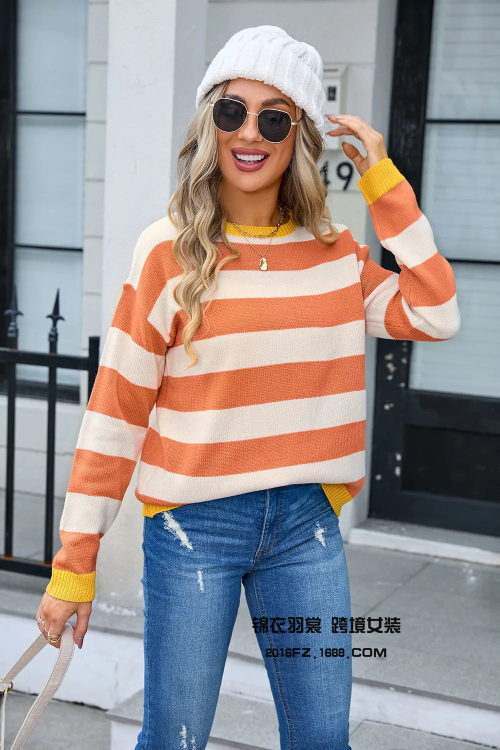 Women's loose-fit acrylic sweater with a floral striped pattern in a blue colour.