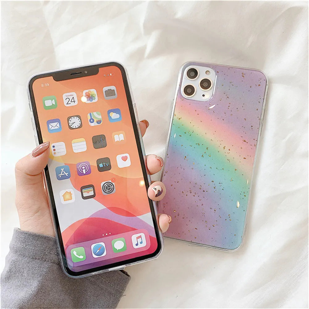Rainbow gradient iPhone case with striped design on a phone