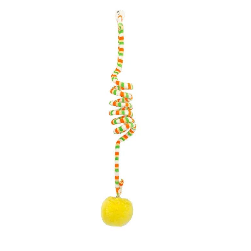Hanging cat toy with bell stick and red inflatable ball attached to a glass door by a suction cup.