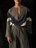 Grey colour-block top with cream front panel and matching wide-leg pants with elastic waistband on a model
