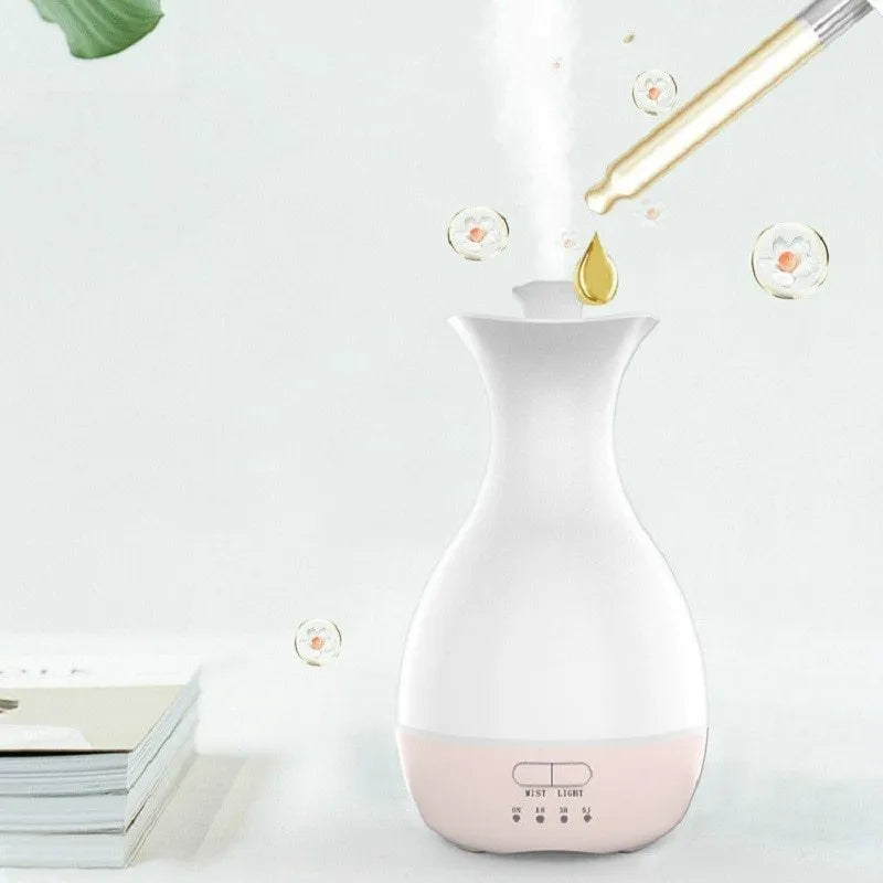 White ultrasonic aromatherapy diffuser with 200ml capacity and multicolour LED lighting on wooden table