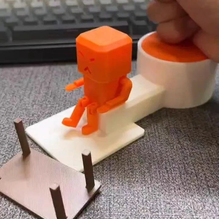 Orange plastic vent decompression toy with table turning mechanism, dimensions 16cm by 6cm by 7cm