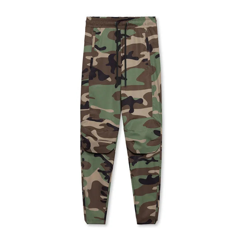 Men's grey loose-fit running pants with ankle ties on a gym floor