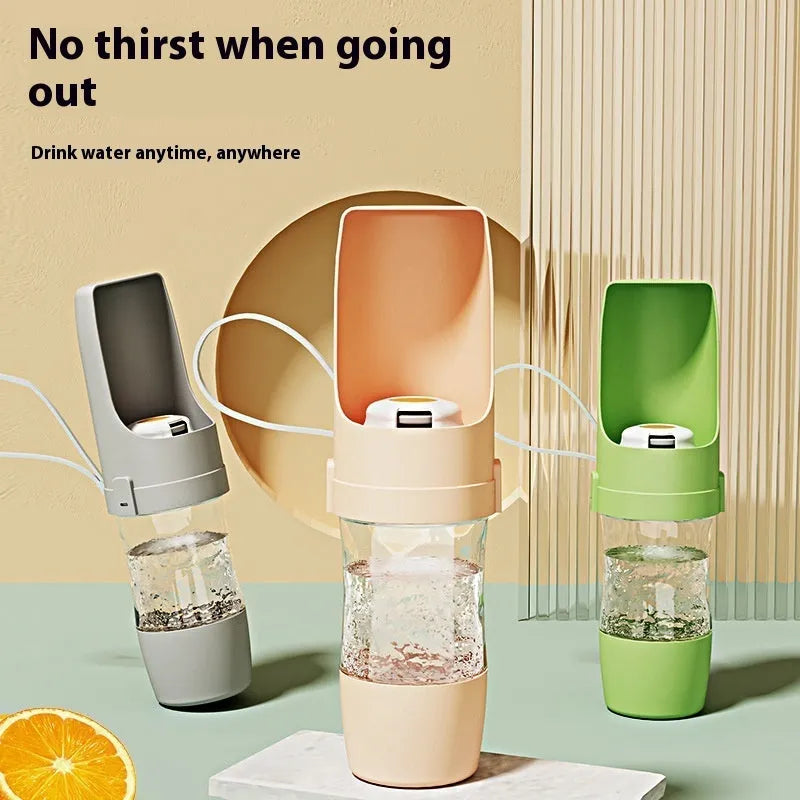 Green 2-in-1 travel dog water bottle and feeder with lanyard, showing folded size.