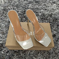 Women's black and silver pointed-toe high heel boots on a white background.
