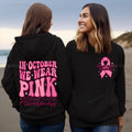 Pink breast cancer awareness pullover hoodie with retro art print and side seam pockets.