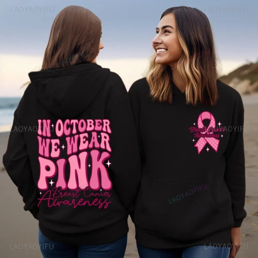 Pink breast cancer awareness pullover hoodie with retro art print and side seam pockets.