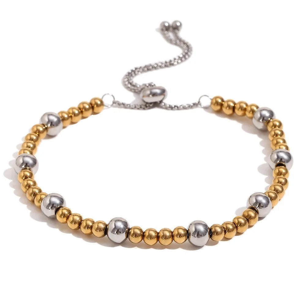 Women's gold electroplated geometric jewellery set with earrings, bracelet and necklace on stainless steel