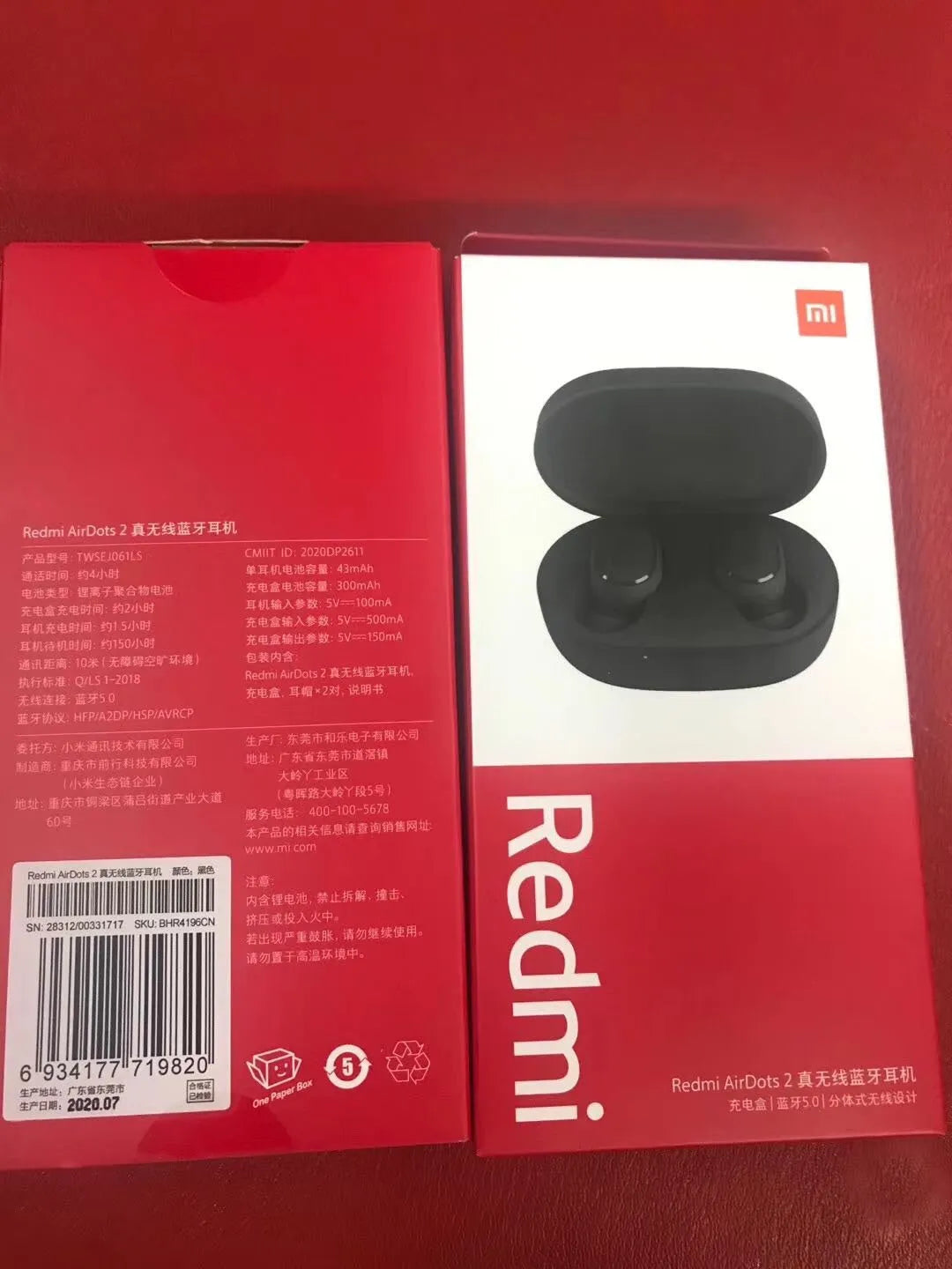Black Redmi AirDots 2 true wireless earbuds and charging case on a white background