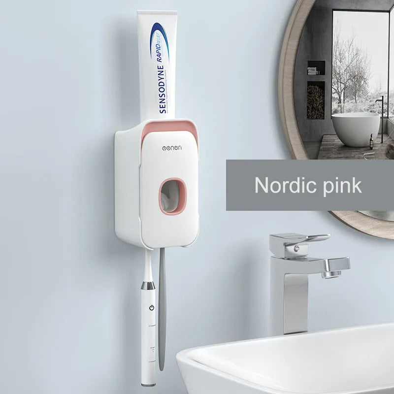 Blue automatic toothpaste dispenser made of ABS plastic on a bathroom shelf.