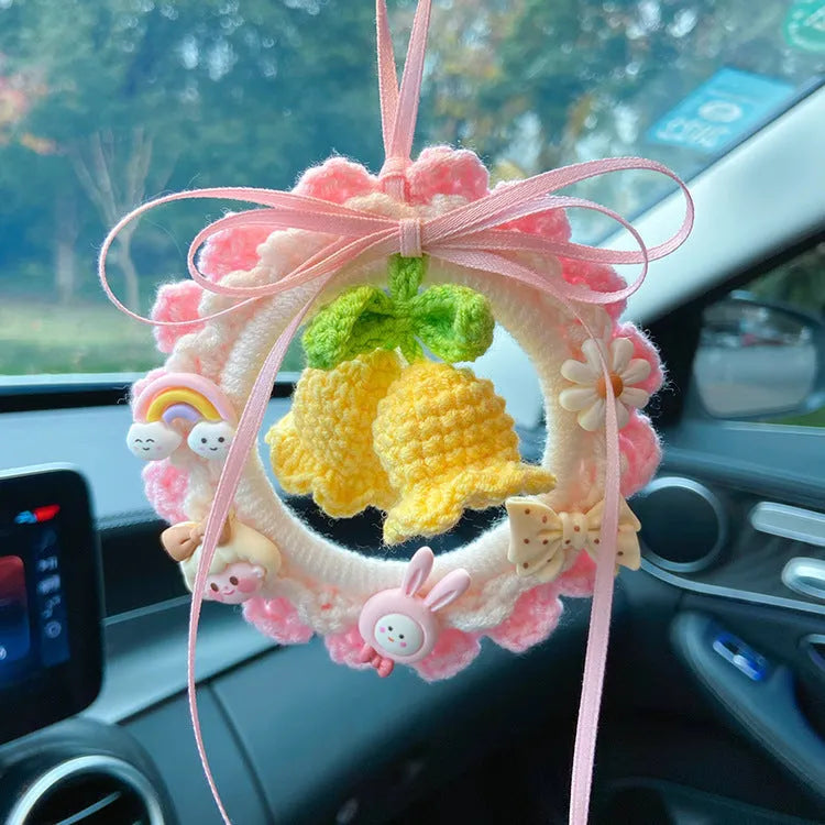 Woven wool bell orchid car pendant in green, pink, purple, and yellow colour options with dream catcher variations