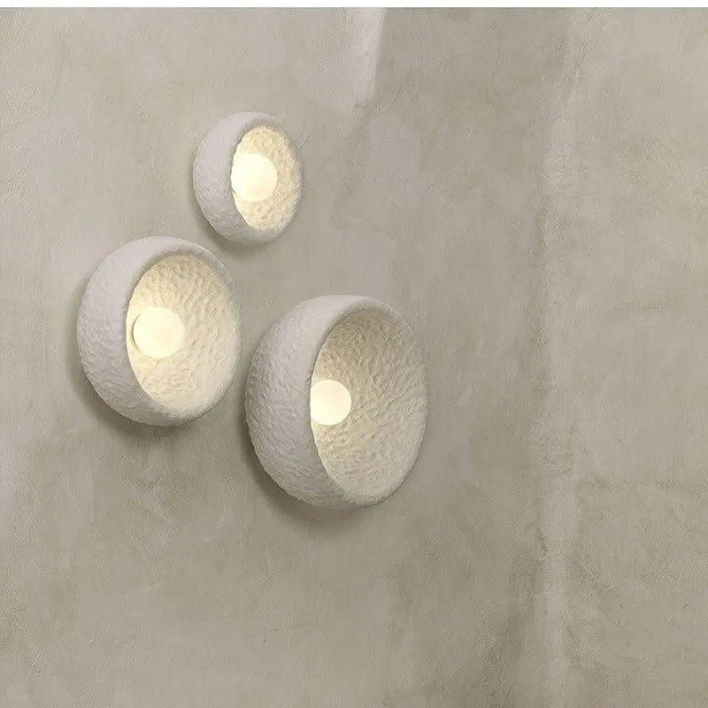 Japanese-style simple modern wall lamp with round resin shade in warm light