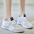 Low-top breathable mesh sneaker with hollow design in various colours on a white background.