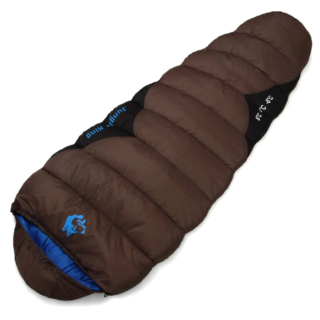 Outdoor cotton sleeping bag in Army Green with its compression sack, sized 230cm long.