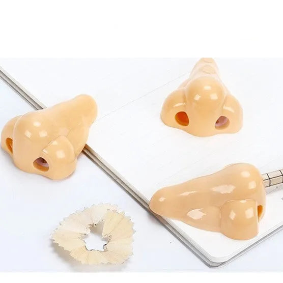 Flesh colour plastic manual pencil sharpener with large shaving container measuring 58x45x30mm