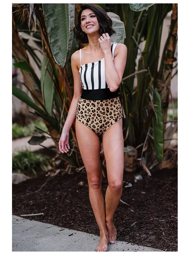 Leopard print women's one-piece swimsuit with an asymmetric collar and high-waisted brief.