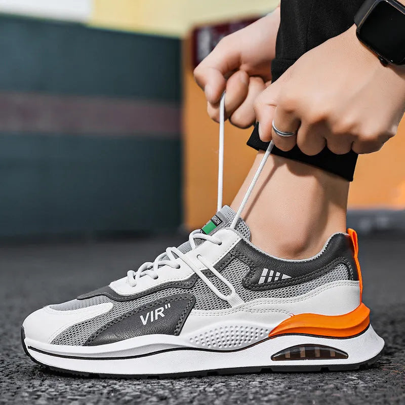Men's grey breathable mesh casual running shoes with a lightweight EVA sole on a white background.