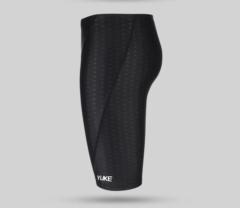 Men's black swimming set including briefs, anti-fog goggles, waterproof cap, ear plug nose clip, and carrying bag