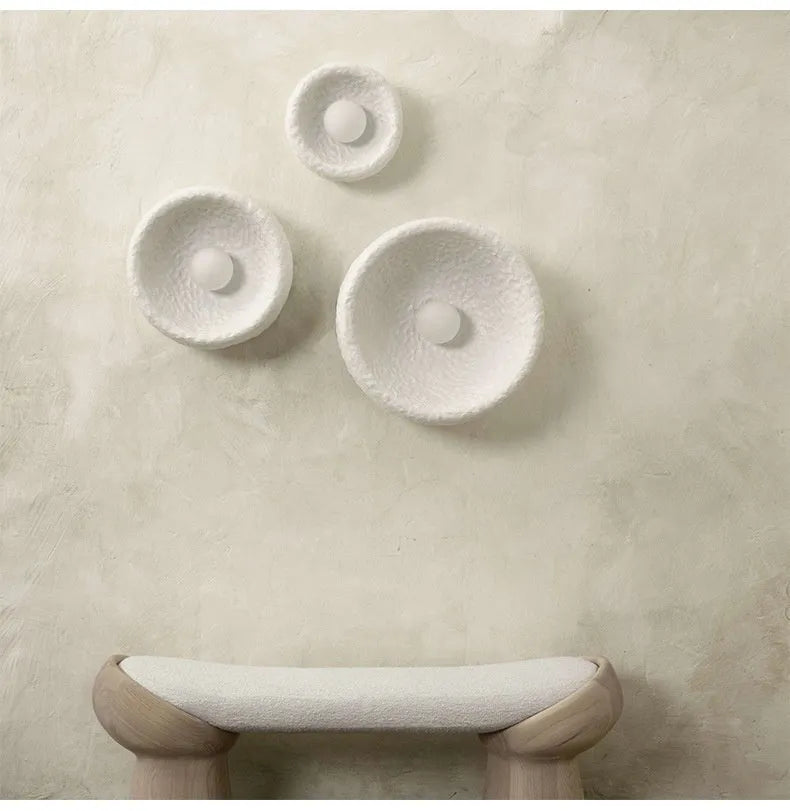 Japanese-style simple modern wall lamp with round resin shade in warm light