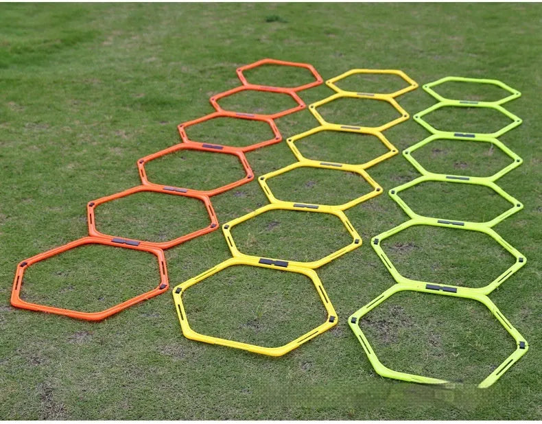 Set of six foldable yellow hexagon plastic agility training rings for sports drills.