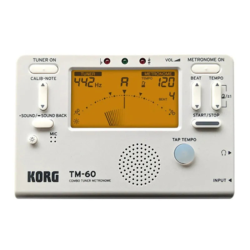 TM-60 black and white universal electronic metronome and tuner on a table.