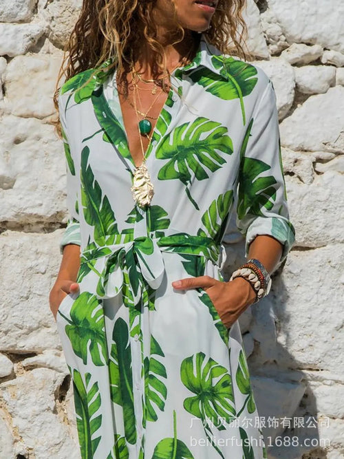 Women's long sleeve V-neck chiffon dress with A-line skirt and printed pattern.