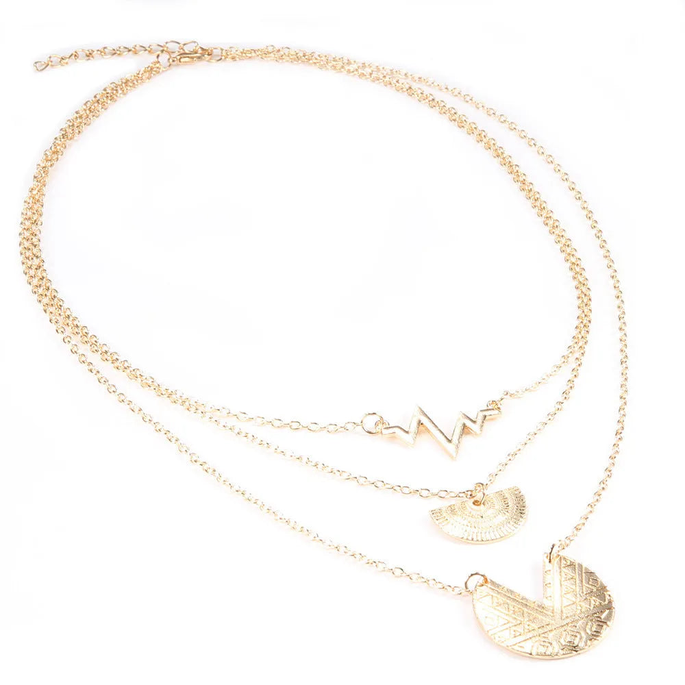 Gold multi-layer round alloy necklace with electroplated finish on white background