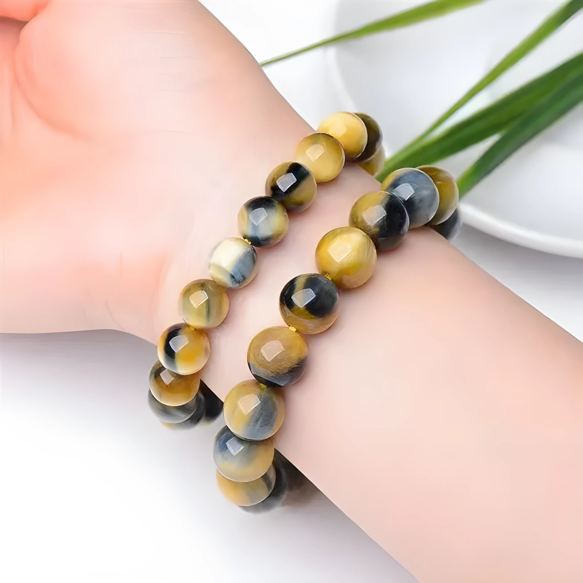 Fantasy Tiger Eye agate beaded bracelet with round beads, shown in unisex design.