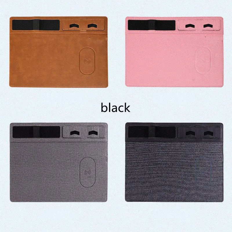 Pink PU leather wireless charging mouse pad with phone holder on a desk, showing USB cable.