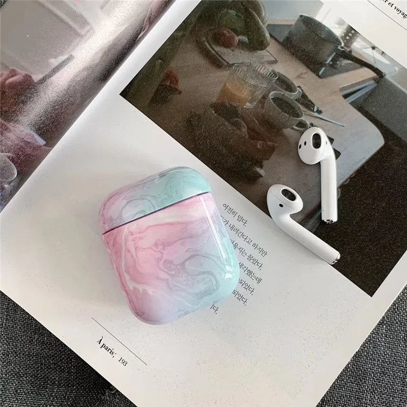 White marble protective case for Apple AirPods charging box showing hard PC construction