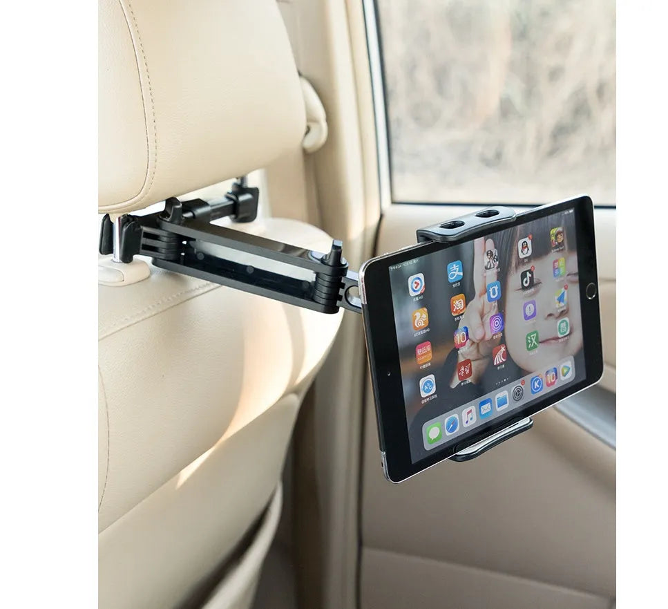 Black universal car phone holder mounted on a car rear seat base, holding a tablet for navigation