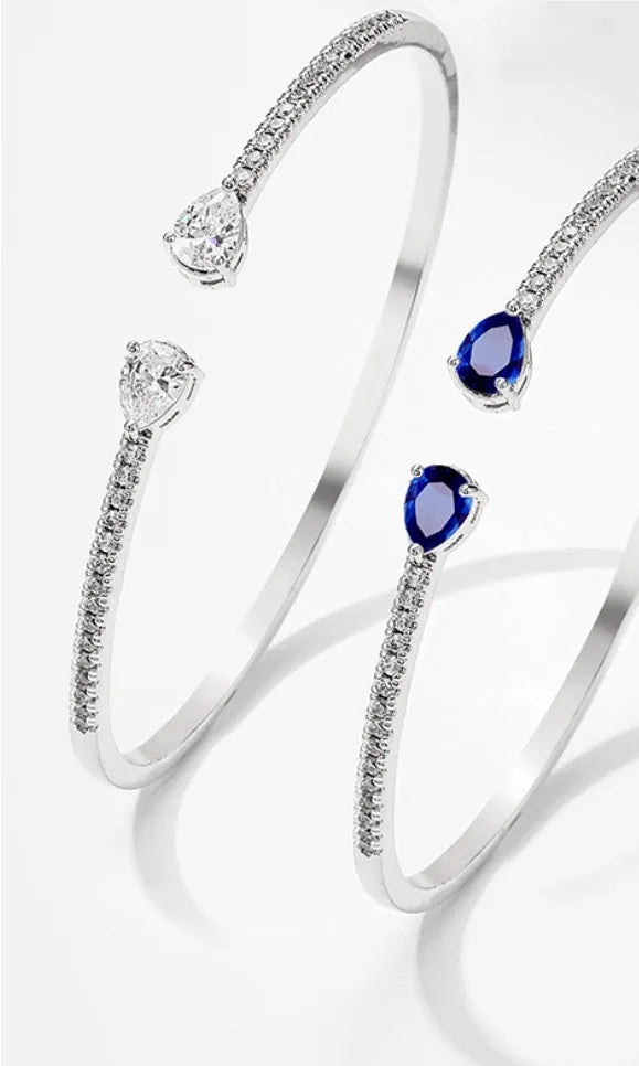 Copper bracelet with inlaid zircon treatment in blue and white colour options