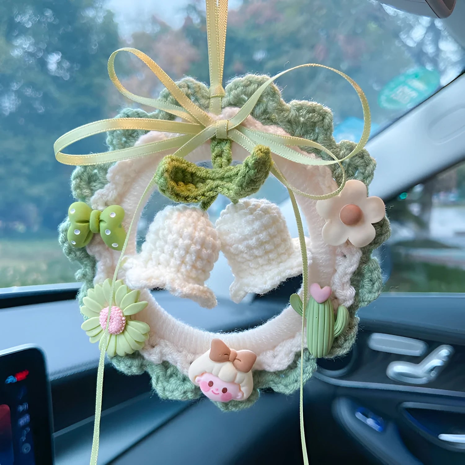 Woven wool bell orchid car pendant in green, pink, purple, and yellow colour options with dream catcher variations