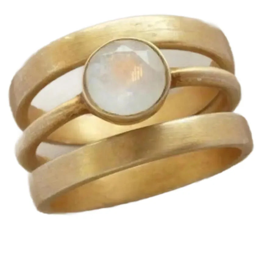 Gold-plated titanium steel ring with a white chalcedony stone in a geometric, micro-inlaid setting.