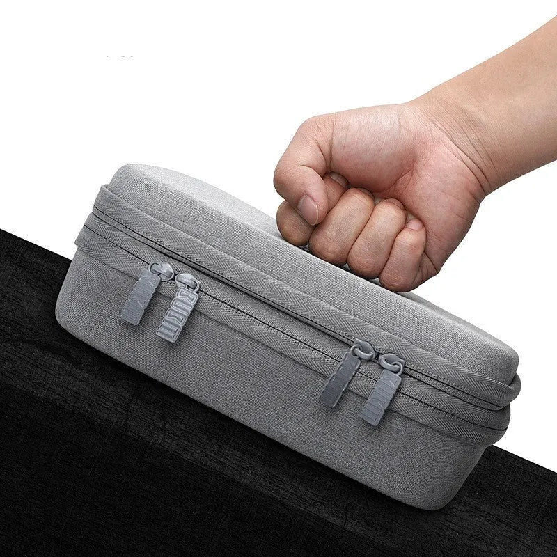 Black EVA digital storage bag with open compartment showing cable organisation