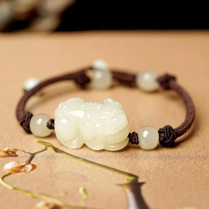 Hetian jade bracelet with braided rope closure in traditional Chinese style
