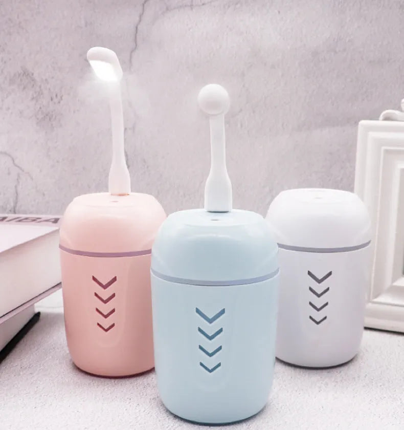 X3 portable car humidifier in columnar shape, shown in blue, pink, and white colour options.