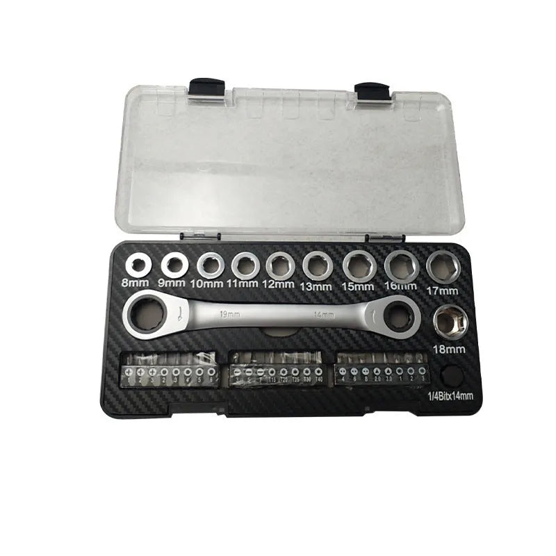 Ratchet wrench set with multiple sockets and bit heads arranged on a workbench