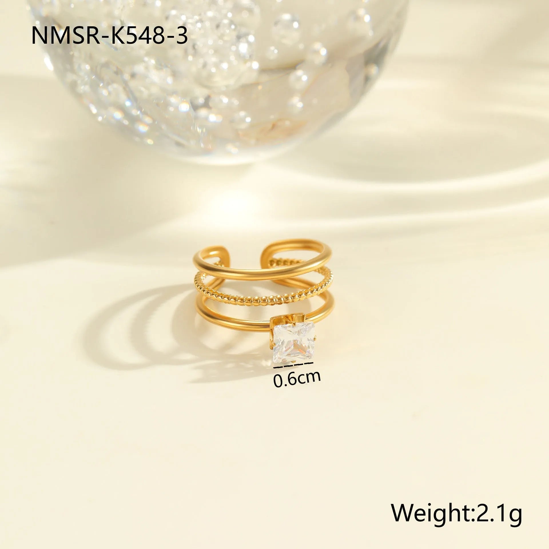 Stainless steel women's ring with gold electroplating and zircon details in geometry design