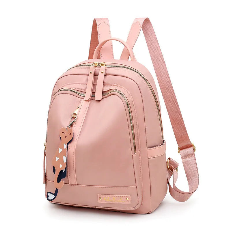 Women's black nylon backpack with double shoulder straps and organisational compartments