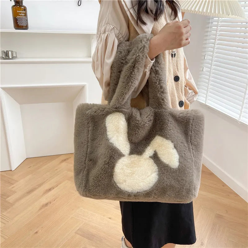 Plush shoulder bag with cartoon rabbit ears design in solid colour options