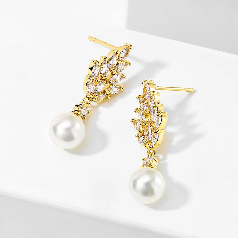 Geometric shaped floral earrings with micro zircon inlays, shown in a gold-tone plated finish.